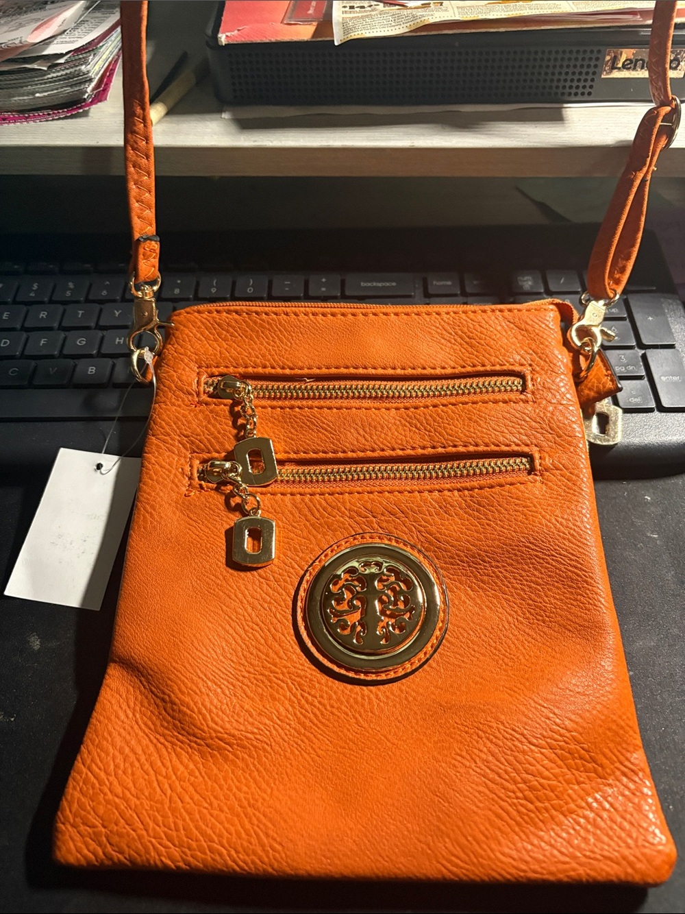 Source Unknown Orange Leather Crossbody Bag with Gold Emblem